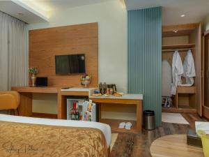 a hotel room with a bed and a television at Hotel sideeq palace in Srinagar