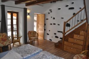 a bedroom with a bed and a stair case at Casa Petrolli in Cannobio +35 photos