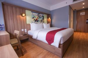 Postel nebo postele na pokoji v ubytování Kuretakeso Kemang Hotel + 37 fotografií