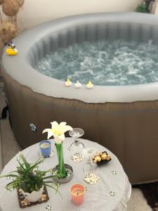 a table in front of a jacuzzi tub at Dreamzloft 1 in Hammam Sousse
