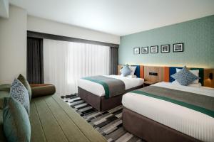 Ένα ή περισσότερα κρεβάτια σε δωμάτιο στο HOTEL MYSTAYS Fukuoka Tenjin Minami +24 φωτογραφίες