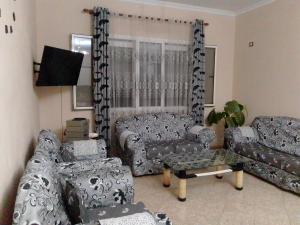 a living room with couches and a table at Villas Eleni for rent best view in Xhafzotaj