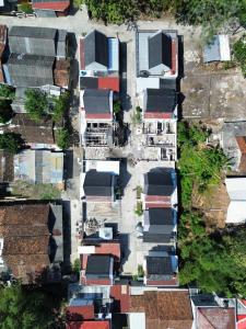 an overhead view of roofs of houses in a city at Berlianohomestay2 in Jarakan