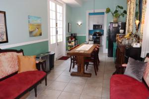 a kitchen with a table and chairs in a room at R&B Bed and Breakfast - Award Winning in New Orleans