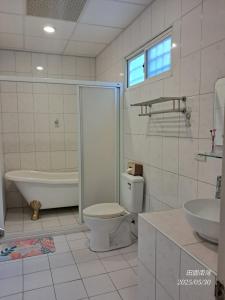 Koupelna v ubytování Tianyuan Nanwan Homestay + 37 fotografií