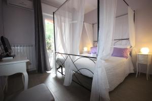 Postel nebo postele na pokoji v ubytování B&B Ai Tre Archi