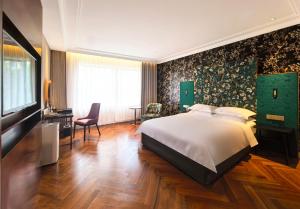 Postel nebo postele na pokoji v ubytování Metropolo Dahua Hotel Shanghai + 37 fotografií