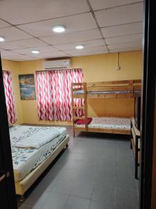 Ένα ή περισσότερα κρεβάτια σε δωμάτιο στο Home Stay Park