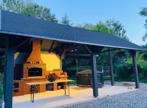 a model of a house with a brick oven at Cabana Patric Valea Avrigului in Avrig