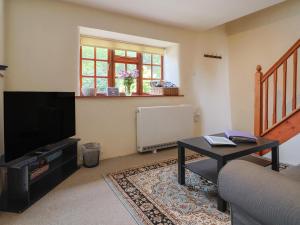 Posezení v ubytování Jasmine Cottage