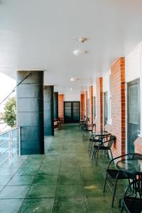 a hallway with tables and chairs in a building at Tourist Hotel Narrabri in Narrabri +27 photos