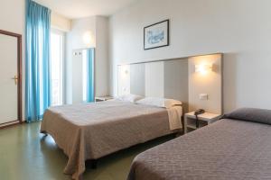 Postel nebo postele na pokoji v ubytování Hotel Concord + 37 fotografií