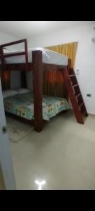 a bunk bed with two bunk beds in a room at Villa Luz in Andrés