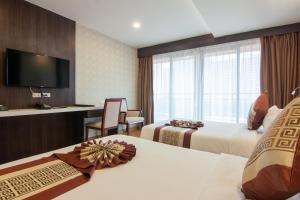 TV a/nebo společenská místnost v ubytování Golden Jomtien Beach Hotel