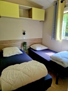 Postel nebo postele na pokoji v ubytování Camping de la Bonnette