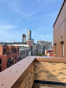 a view of the city from the roof of a building at Cozy flat Near Manchester - Private double room with WiFi in Manchester