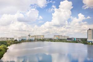 a large body of water in front of a city at Ramada Plaza by Wyndham Orlando Resort & Suites Intl Drive - Newly Renovated! in Orlando