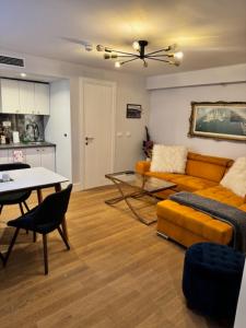 a living room with a couch and a table at Casa Del Telegrafo in Labin