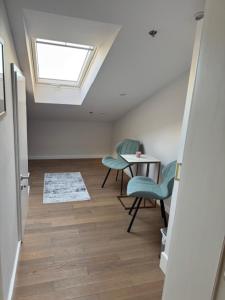 a room with a table and chairs and a skylight at Casa Del Telegrafo in Labin +6 photos