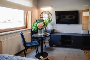 Telewizja i/lub zestaw kina domowego w obiekcie Hotel Kosmowski