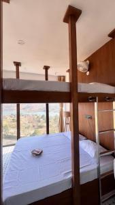 a bedroom with a bunk bed and a balcony at JSOT Glamping Resort in Kolvan