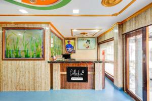 a lobby of a restaurant with a sign on the wall at Collection O Rayagada Bus Stand in Rāyagada