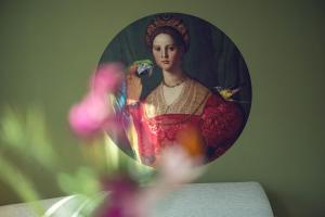 a reflection of a portrait of a woman in a mirror at LeonArt Living 44 in Graz