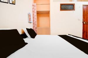 Posteľ alebo postele v izbe v ubytovaní Hotel O G.D Guest House