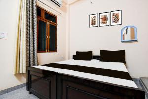 Posteľ alebo postele v izbe v ubytovaní Hotel O G.D Guest House