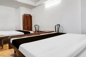 Postel nebo postele na pokoji v ubytování Hotel O Kavish Residency + 30 fotografií