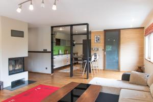 a living room with a couch and a table at Apartment in Pärnu Seaside Neighbourhood in Pärnu