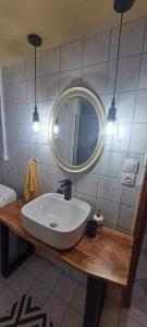 a bathroom with a white sink and a mirror at Konstalia in Moúdhros +36 photos