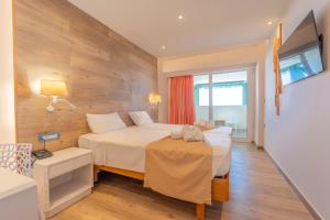 Postel nebo postele na pokoji v ubytování Arte Hotel