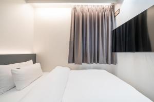 Krevet ili kreveti u jedinici u objektu Hound Hotel Mokpo Peace Plaza