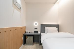 Krevet ili kreveti u jedinici u objektu Hound Hotel Mokpo Peace Plaza