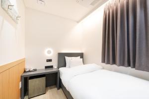 Krevet ili kreveti u jedinici u objektu Hound Hotel Mokpo Peace Plaza
