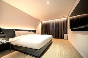 Krevet ili kreveti u jedinici u objektu Hound Hotel Mokpo Peace Plaza