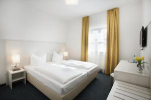 Postel nebo postele na pokoji v ubytování Hotel Wandinger Hof by Lehmann Hotels