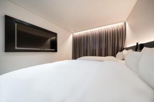 Krevet ili kreveti u jedinici u objektu Hound Hotel Mokpo Peace Plaza