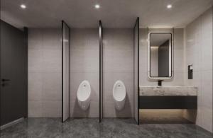 a bathroom with two urinals and a sink and a mirror at Atour Hotel Chongqing Grand Hall Jialing River Riverside Road in Chongqing +6 photos