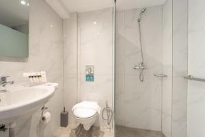 Koupelna v ubytování Arte Hotel