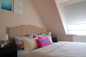 Ένα ή περισσότερα κρεβάτια σε δωμάτιο στο Sinfonia