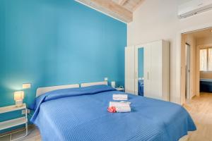 Postel nebo postele na pokoji v ubytování Casa del Geco Sanremo - Happy Rentals
