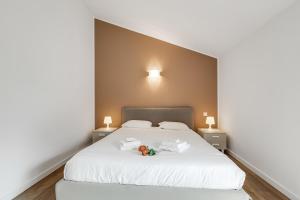 Una cama o camas en una habitación de Viganello Modern Apartments