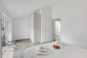Una cama o camas en una habitación de Viganello Modern Apartments