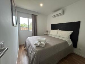 a bedroom with a bed with two towels on it at Quinta da Joia in Silves +19 photos