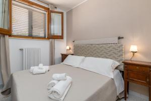 Posteľ alebo postele v izbe v ubytovaní Piccolo Hotel Villa Rosa