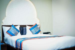 Ένα ή περισσότερα κρεβάτια σε δωμάτιο στο Hotel Aripan