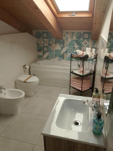 a bathroom with a sink and a tub and a toilet at Vacanze nel Cilento in Agropoli +36 photos