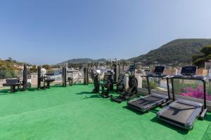 a group of treadmills and ellipticals on a roof at Pagoda Lifestyle Hotel in Ischia